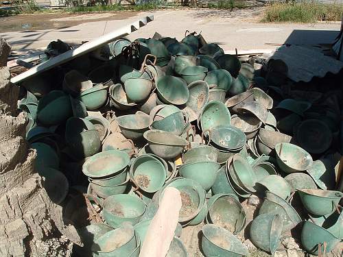 Pile of Helmets &amp; MIG jet seen in Iraq