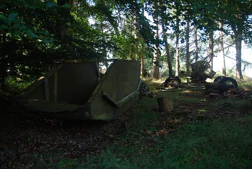 found an antiaircraft gun and metal ammo boxes in a forest....