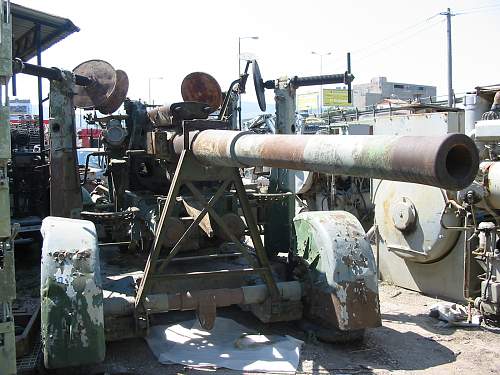 A  3,7 inch  A/A GUN  in a Military Surplus Yard