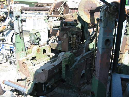 A  3,7 inch  A/A GUN  in a Military Surplus Yard