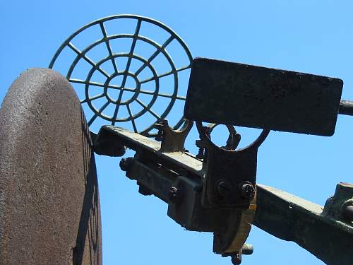 A  3,7 inch  A/A GUN  in a Military Surplus Yard