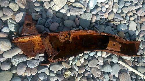 sizeable rusty metal piece washed up...