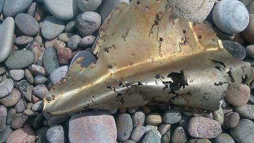 sizeable rusty metal piece washed up...