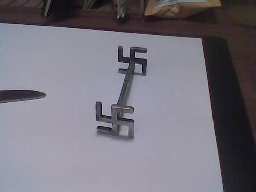 Swastika knife rest.