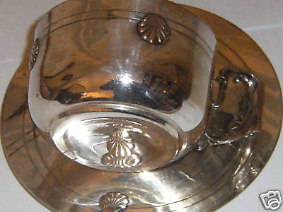 silver cup and saucer