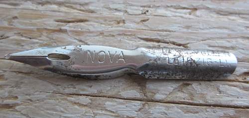 German porcelain fragments  and makers marks on other items  from conflict archaeology excavation in Finland