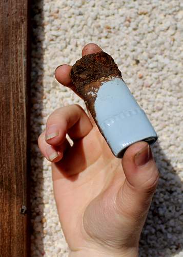 German porcelain fragments  and makers marks on other items  from conflict archaeology excavation in Finland