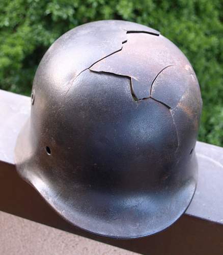 relic helmet wit black paint and battle damaged?