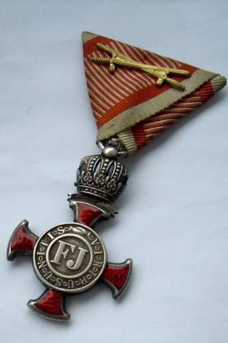 Austro Hungarian Franz Joseph Silver Merit Cross with Crown on War Ribbon with Swords.