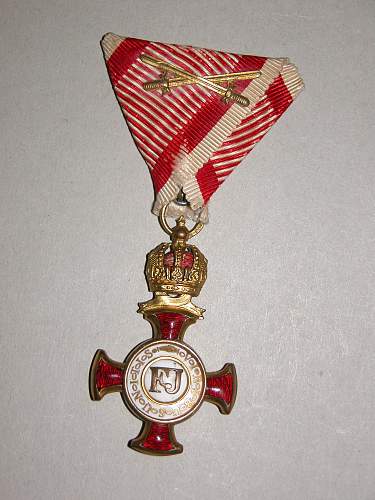 Golden Cross of Merit with Crown, on wartime ribbon with swords (Goldenes Verdienstkreuz mit Krone, am Kriegsband mit Schwertern) by Wilhelm Kunz of Vienna.