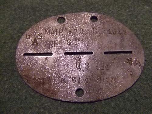 A few axis erkennungsmarken, dog tags.