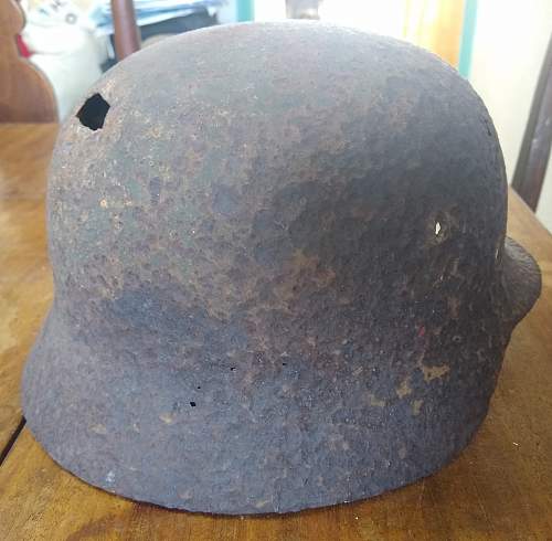 M35 battle damaged helmet