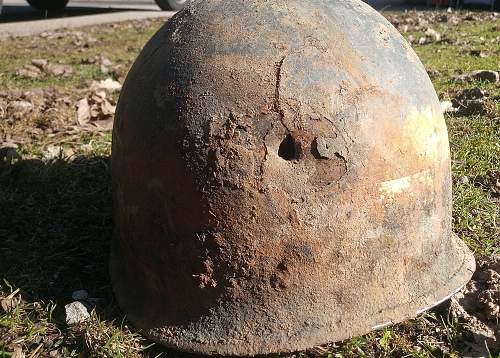 M35 battle damaged helmet