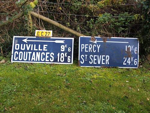 Battle damaged Road sign route to a Knights Cross.