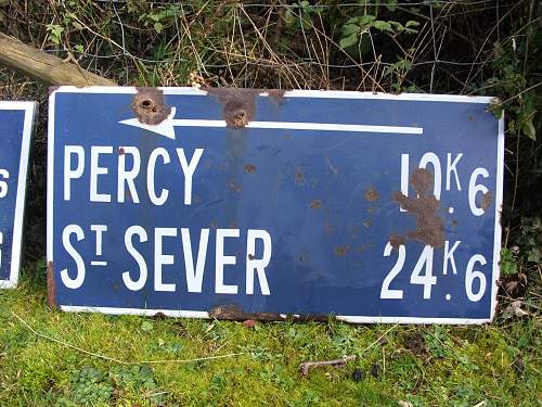 Battle damaged Road sign route to a Knights Cross.