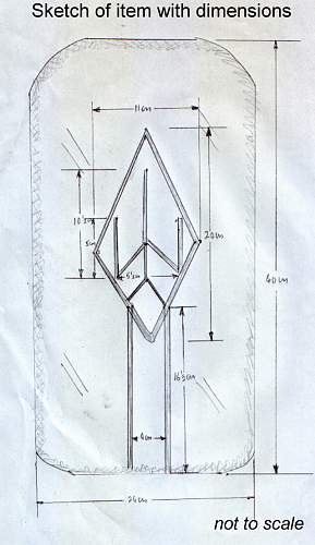 Sottevast V site relic, rocket shaped design marked with runes
