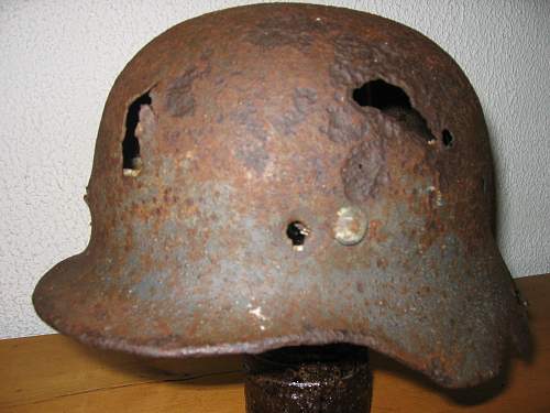 Battle damaged German lids