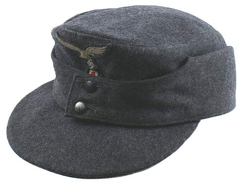Officer's Kriegsmarine cap, Luftwaffe Einheitsfeldmuetze, and pith helmet