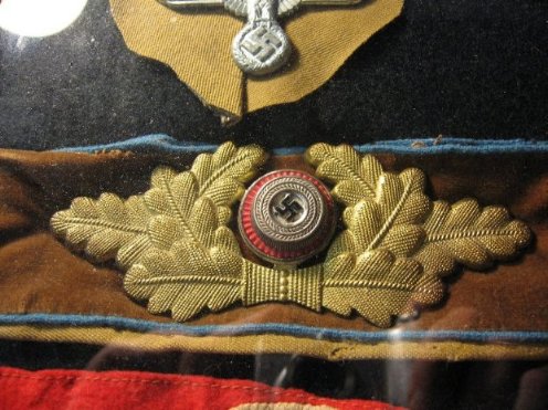 Cut off cap insignia