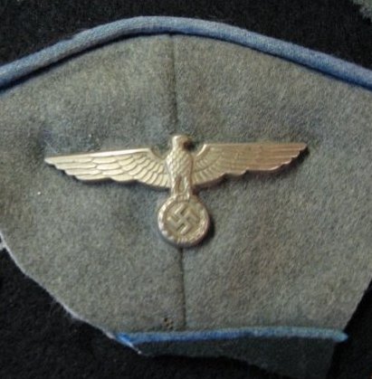 Cut off cap insignia