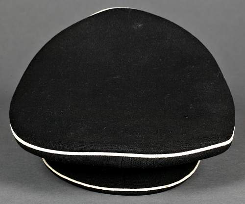 black SS officer cap, leather peak.