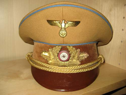 Can anyone identify the maker on this Ortsgruppe visor?