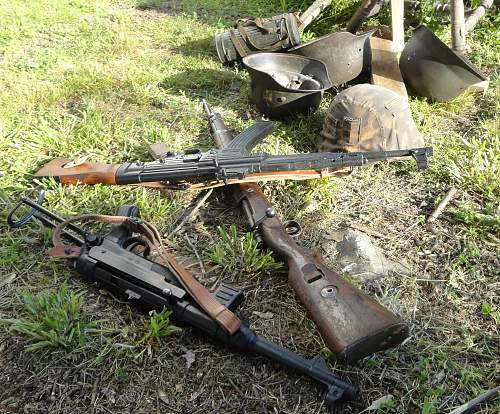 Discarded German Weapons And Helmets