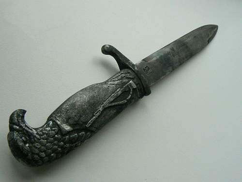 Fake engraved knives with eagle head/German helmet handles?