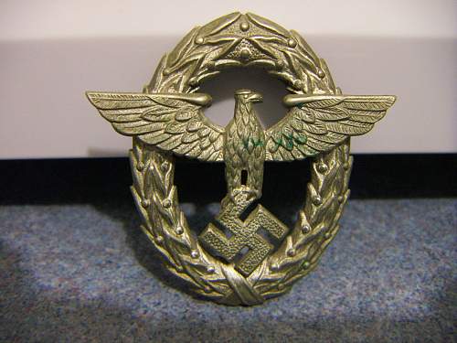 Police hat badge