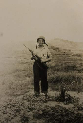 WW2 Era photo showing American GI holding an M1 .30 Cal Carbine. From my collection