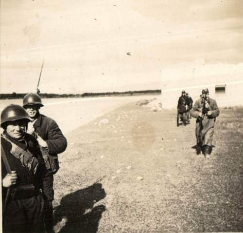 Soviet soldiers wearing SSh-36 helmets