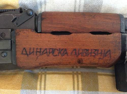 Cyrillic script on the woodwork of a Zastava M72B1