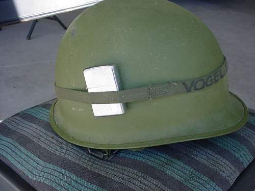 Vietnam helmet and Zippo