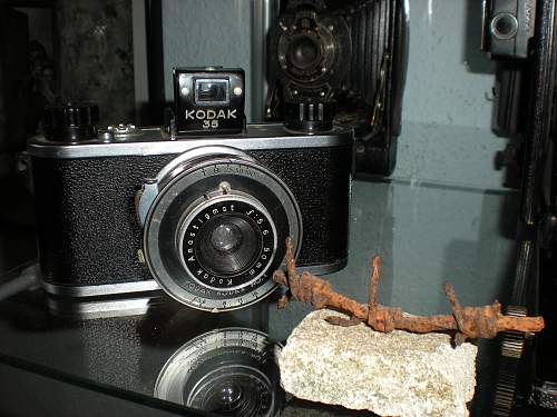 Cameras and insignia of U.S. war photographers