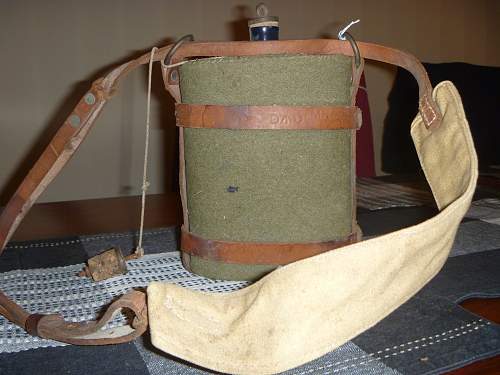 1942 british water bottle and leather harness.