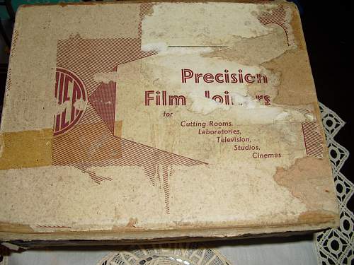 16mm film splicer in box with some diggers