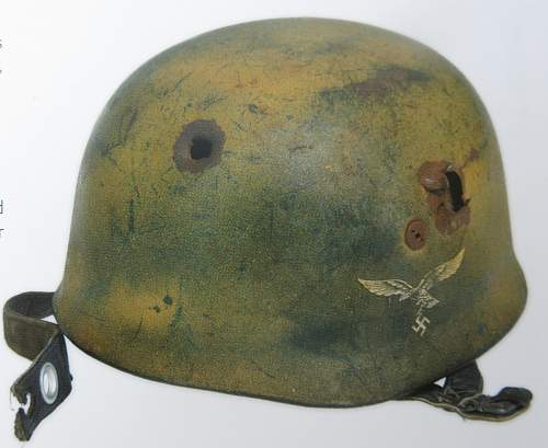 A battle damaged tan cammo Ramcke Brigade Para helmet
