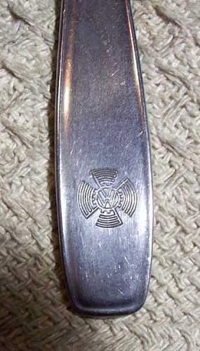 Knife, fork, spoon set in can opener type holder