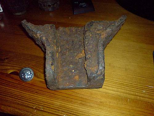 Hi I am new here today ! Tank Track fragment or heavy artillery sight mount partly damaged ??