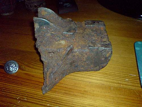 Hi I am new here today ! Tank Track fragment or heavy artillery sight mount partly damaged ??