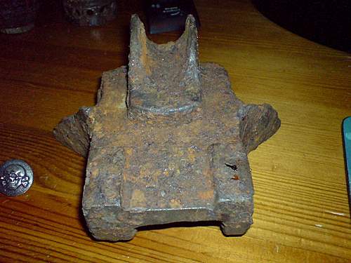Hi I am new here today ! Tank Track fragment or heavy artillery sight mount partly damaged ??