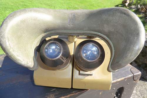 A pair of dkl 10 x 80 binoculars in the box.