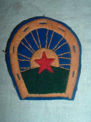 A couple of early cloth insignia
