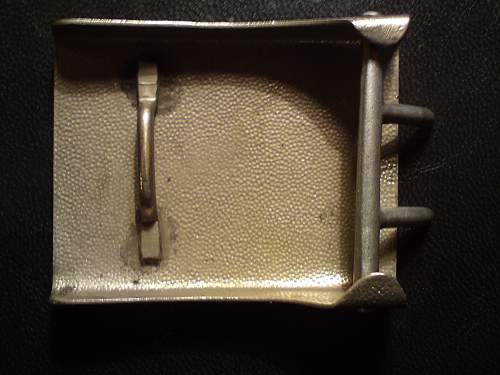 Unknown blank grained steel buckle.