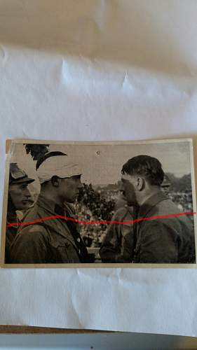Hitler and an injured SA man.