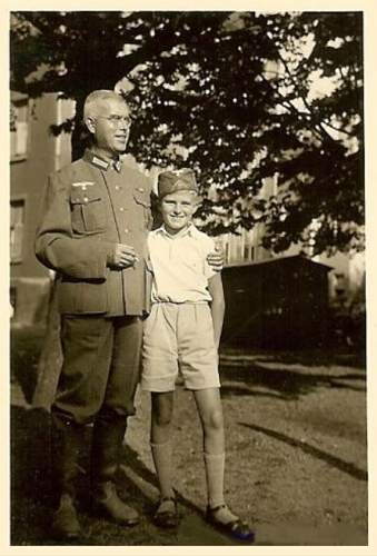 Soldier with boy &amp; boy in uniform