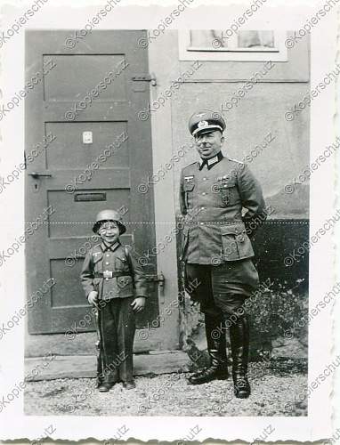 Soldier with boy &amp; boy in uniform