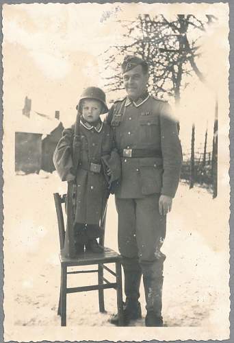 Soldier with boy &amp; boy in uniform