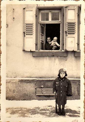 Soldier with boy &amp; boy in uniform