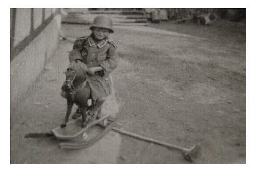 Soldier with boy &amp; boy in uniform